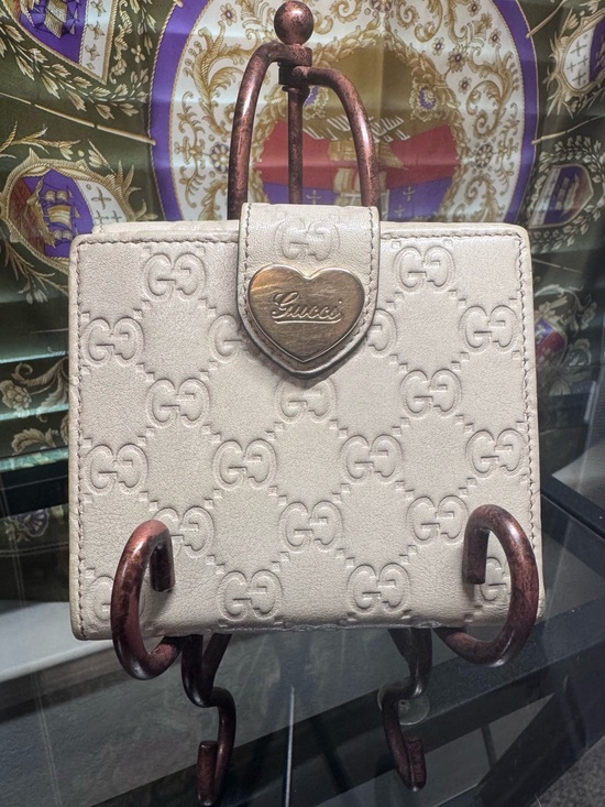 Gucci Accessories - Gucci Cream Embossed GG Wallet with Heart Clasp